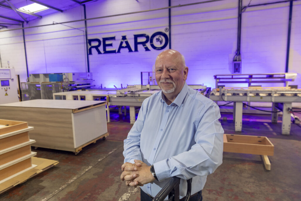 Head of Sales and Marketing, Robert Bennett in front of Rearo Sign Author of "Why The Smallest Room In The House Is Now Big Business"